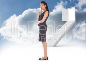 Composite image of thoughtful businesswoman