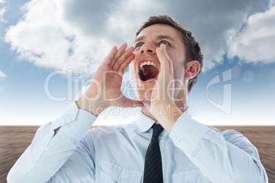 Composite image of businessman shouting