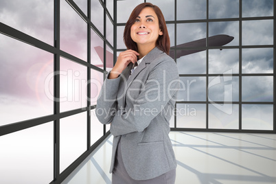 Composite image of thoughtful businesswoman