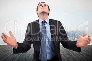 Composite image of businessman posing with arms out