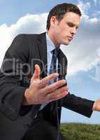 Composite image of businessman posing with arms out