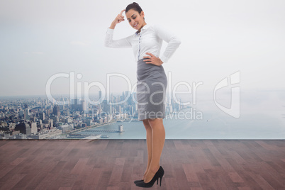 Composite image of smiling thoughtful businesswoman