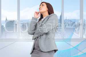 Composite image of focused businesswoman