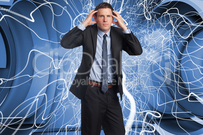 Composite image of stressed businessman with hands on head