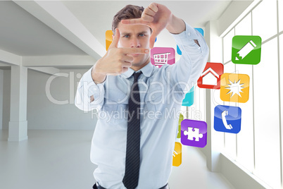 Composite image of businessman making frame with hands