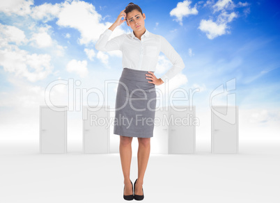 Composite image of worried businesswoman