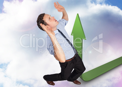 Composite image of businessman posing with arms raised