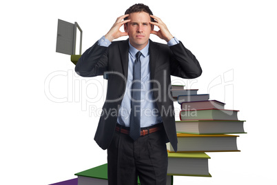 Composite image of stressed businessman with hands on head