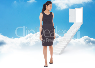 Composite image of asian businesswoman walking