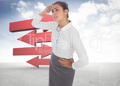 Composite image of worried businesswoman