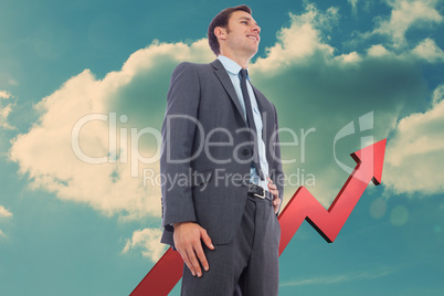 Composite image of cheerful businessman with hand on hip