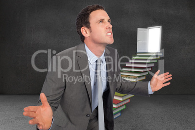 Composite image of businessman posing with hands out