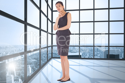 Composite image of thoughtful businesswoman