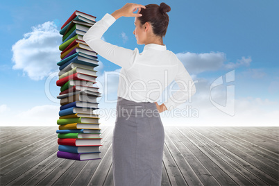 Composite image of businesswoman scratching her head