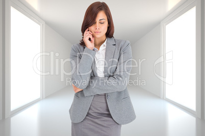 Composite image of thinking businesswoman