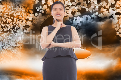 Composite image of thinking asian businesswoman