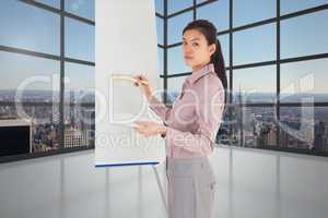 Composite image of businesswoman painting on an easel