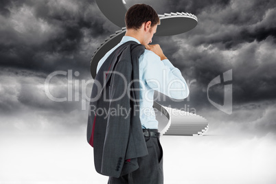 Composite image of businessman holding his jacket