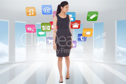 Composite image of asian businesswoman walking