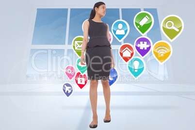 Composite image of asian businesswoman walking