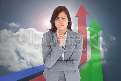 Composite image of worried businesswoman