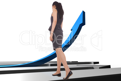 Composite image of asian businesswoman walking