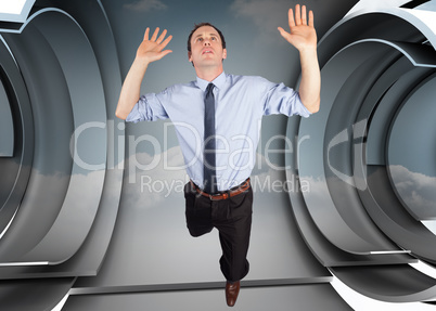 Composite image of businessman posing with arms raised