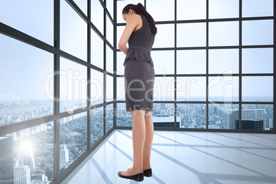 Composite image of thinking asian businesswoman