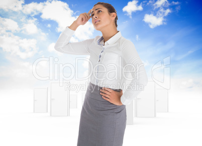 Composite image of worried businesswoman