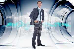 Composite image of smiling businessman with hands on hips