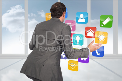 Composite image of businessman posing with hands out