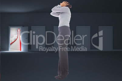 Composite image of businesswoman with hands on head