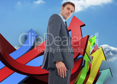 Composite image of stern businessman standing