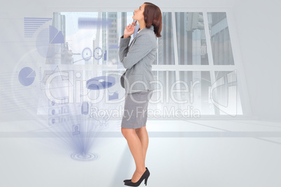 Composite image of focused businesswoman