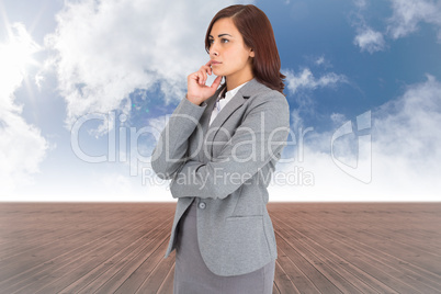 Composite image of serious businesswoman
