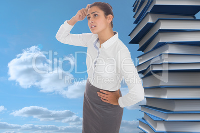 Composite image of worried businesswoman