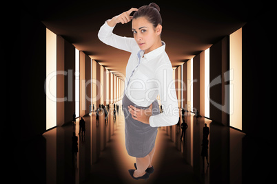 Composite image of focused businesswoman