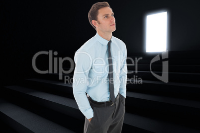 Composite image of serious businessman with hands in pockets