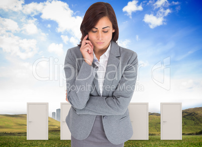 Composite image of focused businesswoman