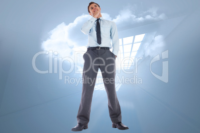 Composite image of thoughtful businessman with hand on chin