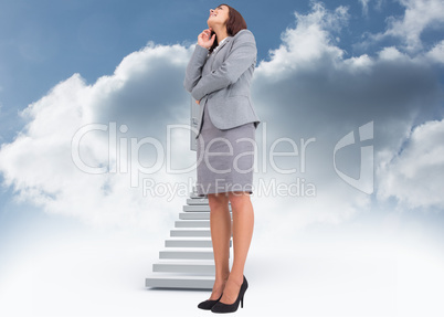 Composite image of smiling thoughtful businesswoman