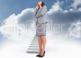 Composite image of smiling thoughtful businesswoman