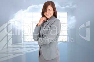 Composite image of thoughtful businesswoman