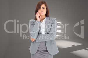 Composite image of upset thinking businesswoman