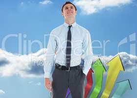 Composite image of smiling businessman standing with hand in poc