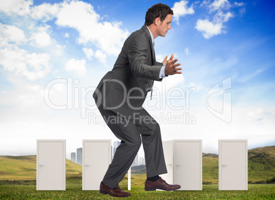 Composite image of businessman standing with arms out