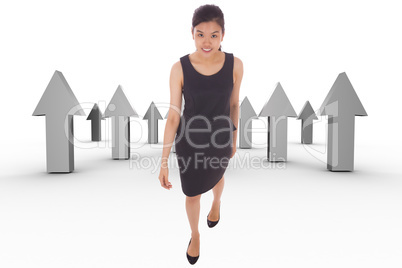 Composite image of asian businesswoman walking