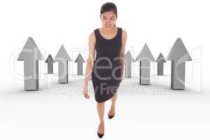 Composite image of asian businesswoman walking