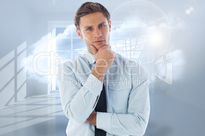 Composite image of thinking businessman with hand on chin