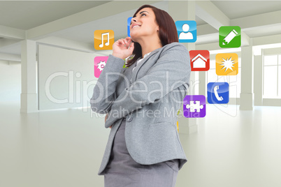 Composite image of smiling thoughtful businesswoman